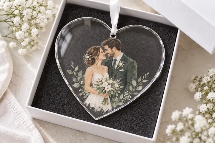 A wedding couple printed on a heart-shaped Glass ornament in a gift box